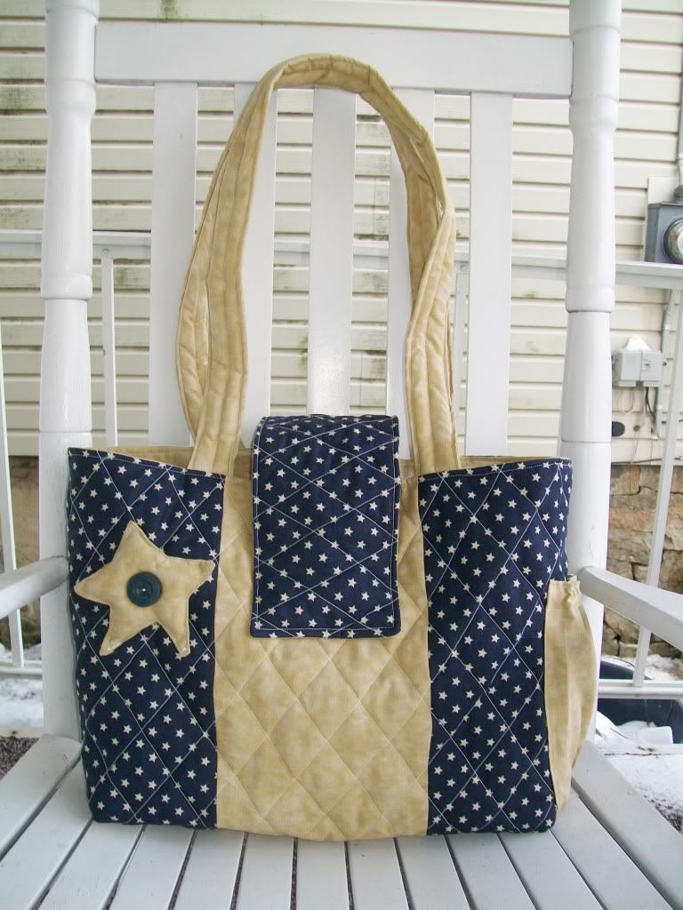 Blue stars and tan diaper bag
