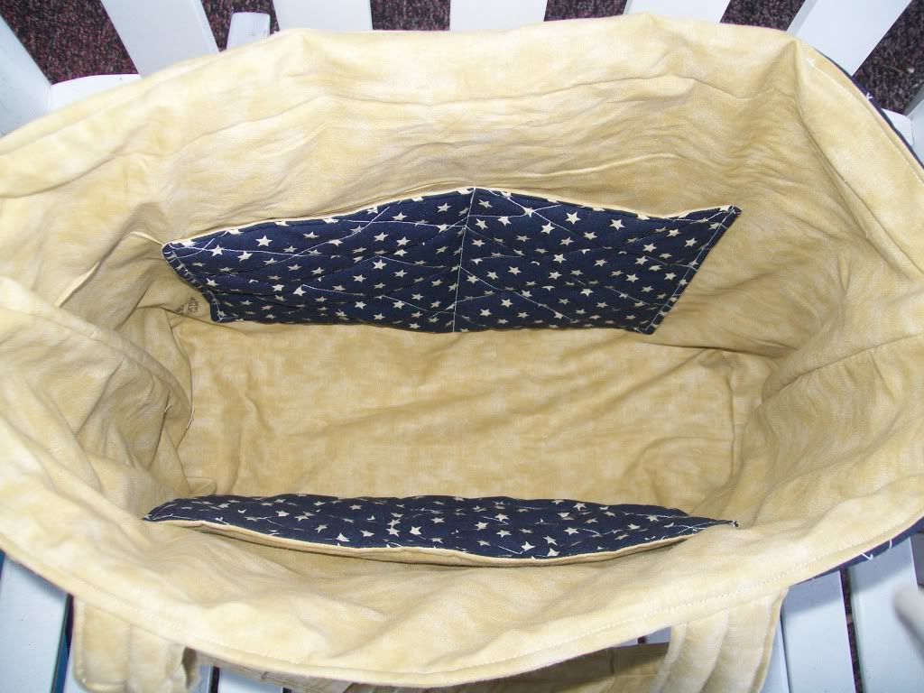 Inside of blue and tan diaper bag