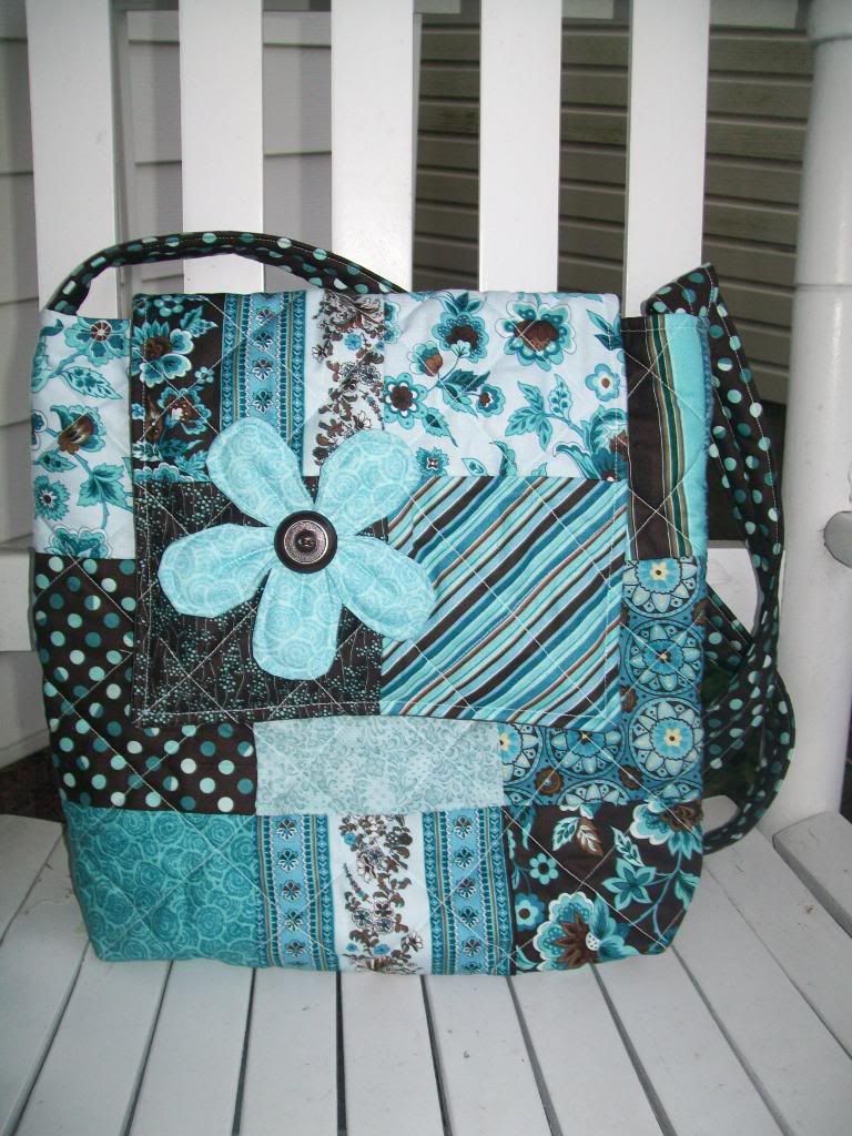 Brown and turquoise messenger with flower