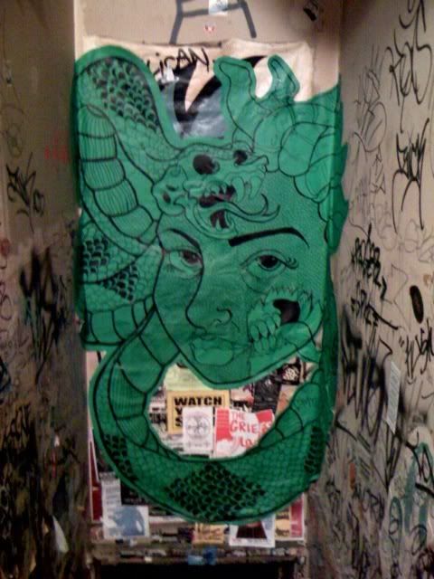 My friend Bobby helped me wheatpaste this jawn last night at Tattooed Mom's.