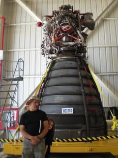 Dad &amp; son in front of engine